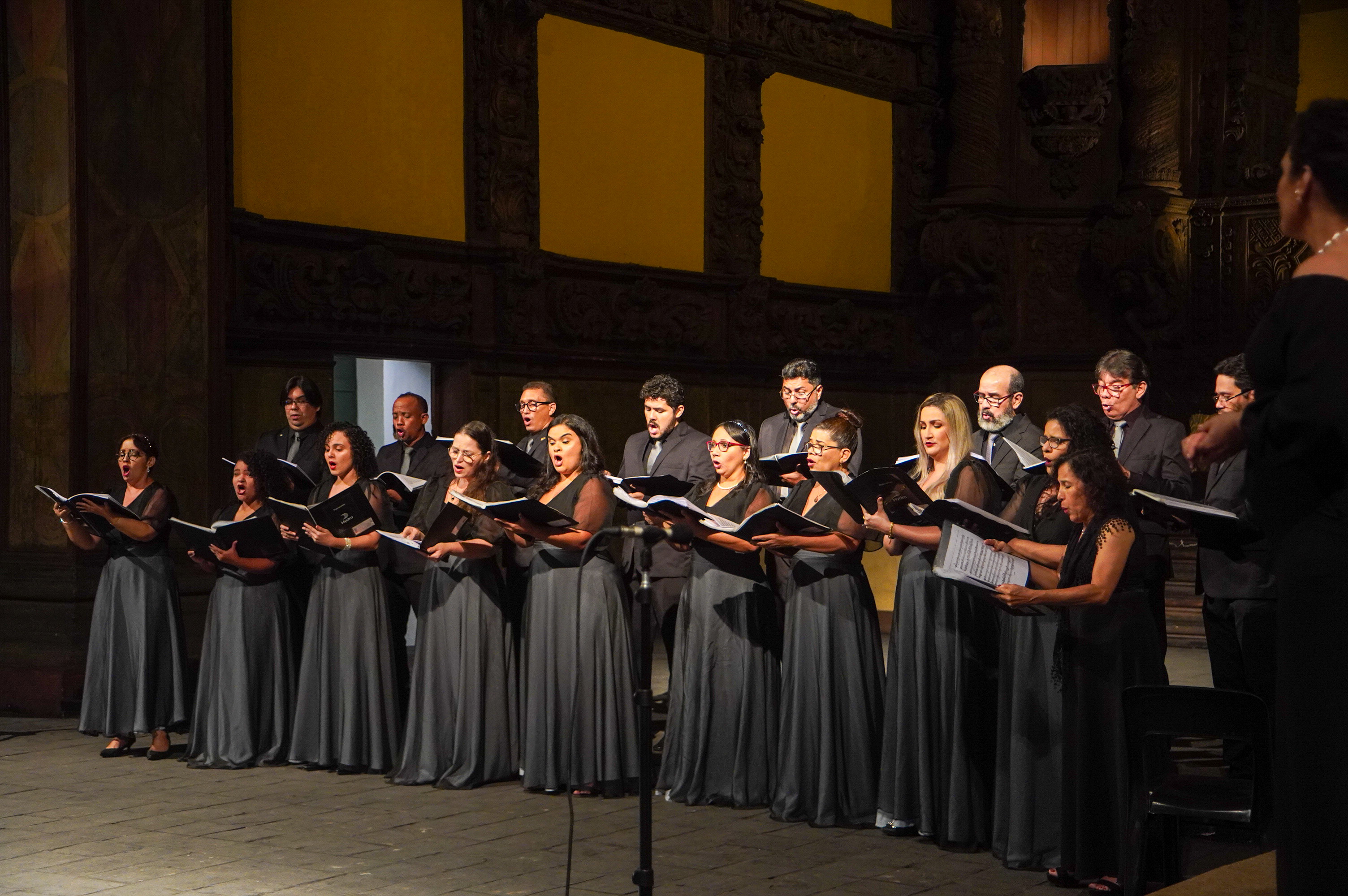 a group of people in black gowns and caps