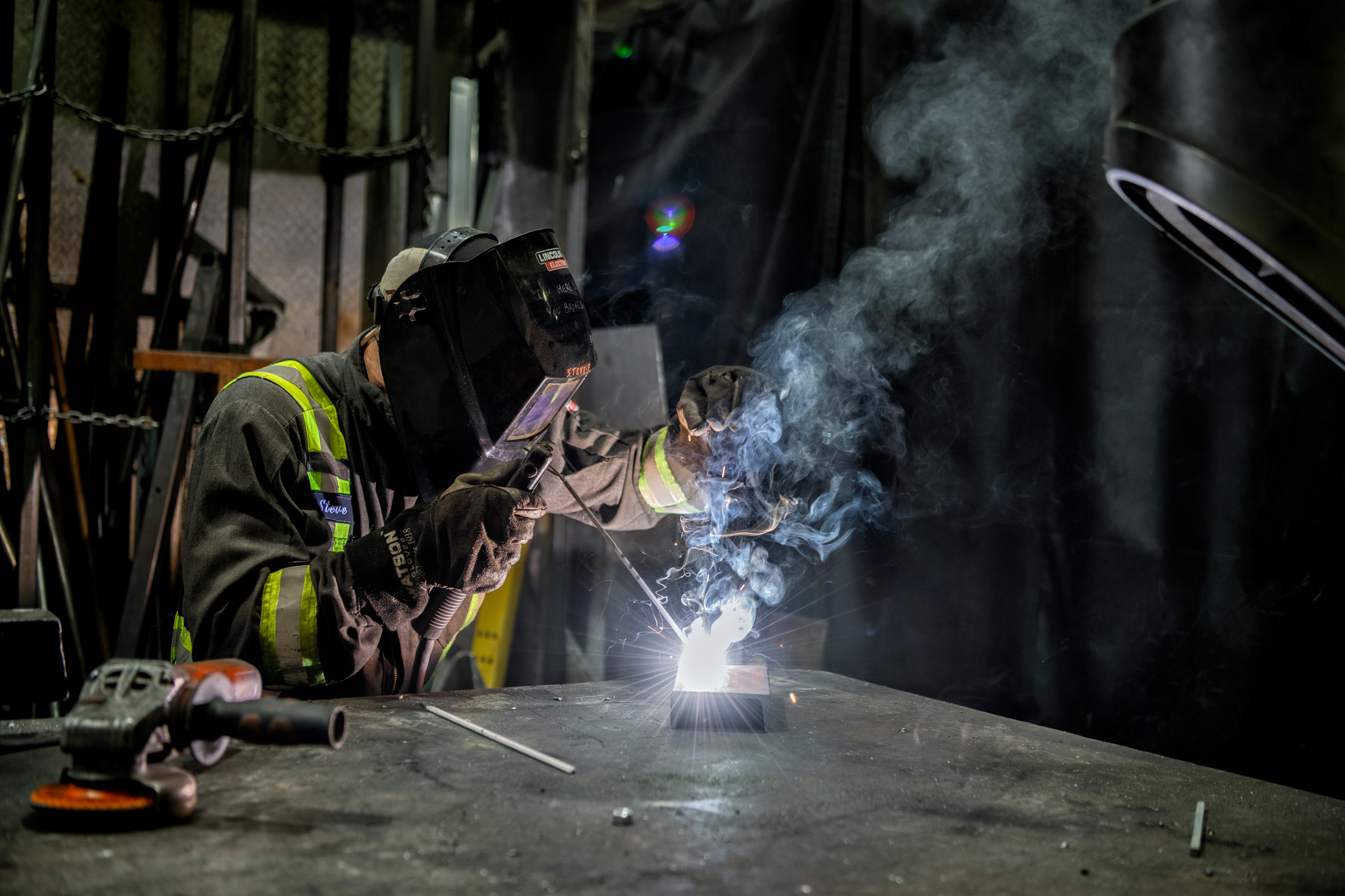 a man welding a piece of metal