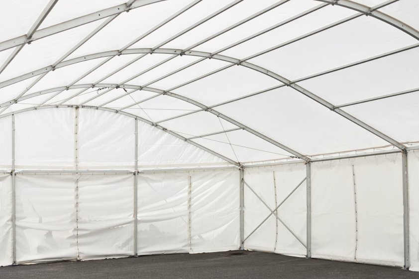 A white walled marquee interior with an aluminium frame