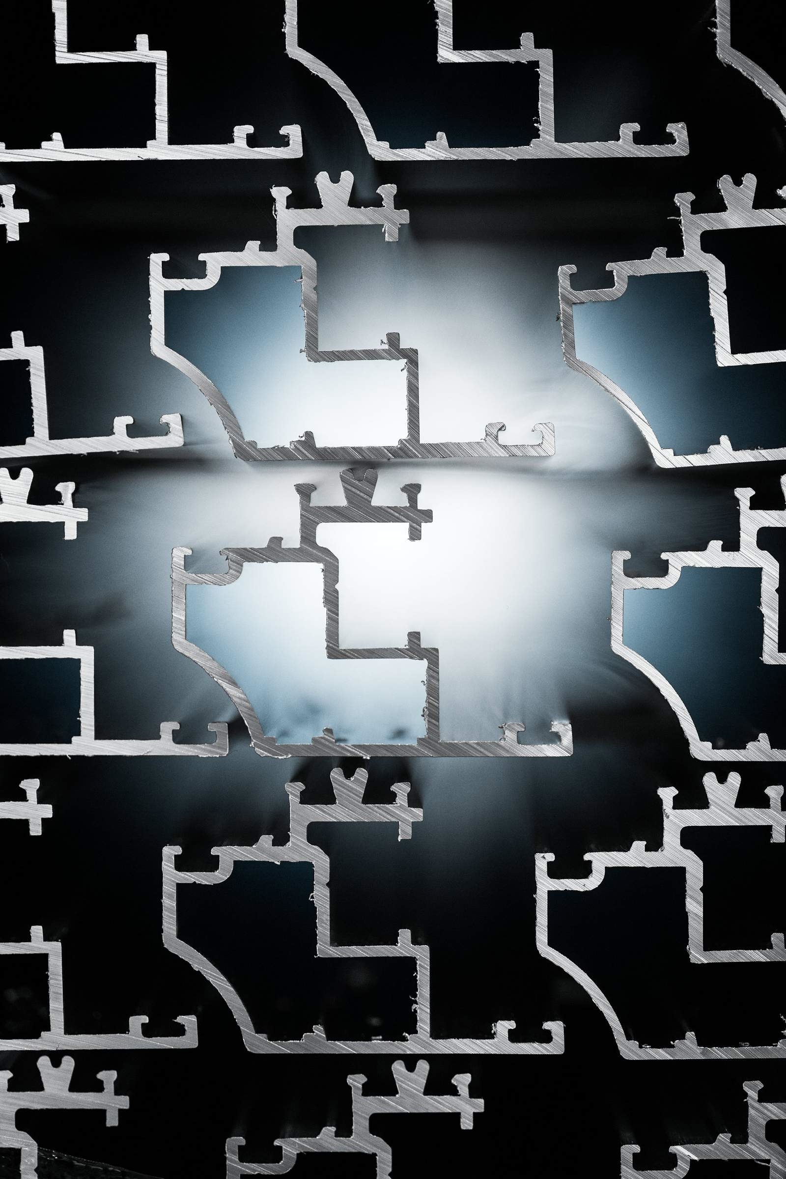 White light shining through a stack of hollow extruded aluminum