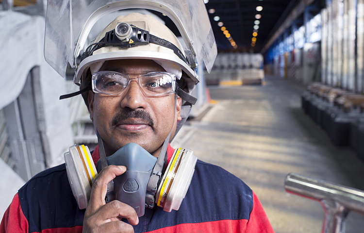 male worker in protective gear on factor floor