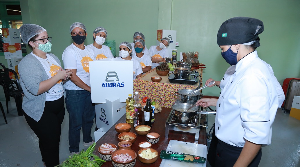 a group of people in a kitchen