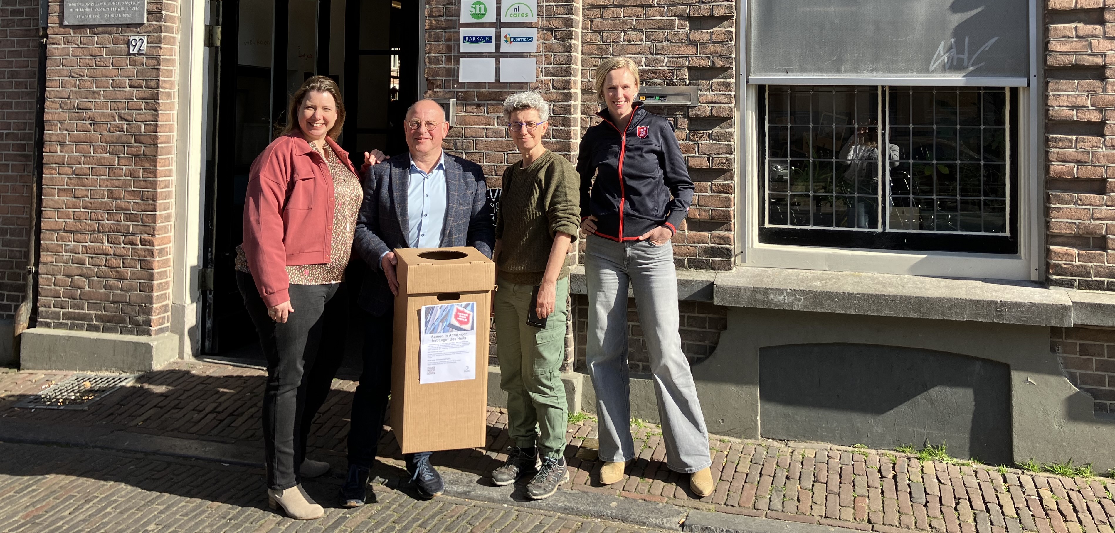a group of people standing outside a building